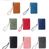 A collection of leather passport holders in various colors including brown, blue, green, red, and black, featuring RFID prote