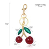 Gold-toned crystal cherry fruit keychain with red and green accents