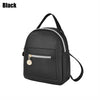 Black waterproof PU mini backpack with a zippered pocket and adjustable strap