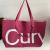 A pink knitted large tote bag with a white strap is shown against a light background.