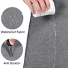 A hand is holding a white cup over a gray waterproof fabric laptop sleeve featuring anti-scratch protection.