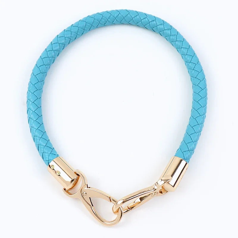 A turquoise PU leather replacement bag strap with gold-toned metal buckles.