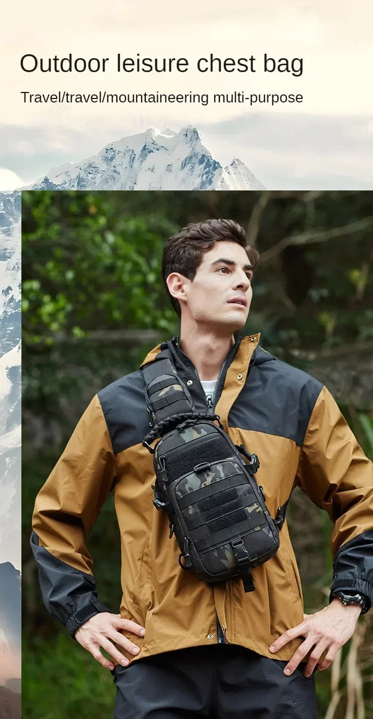 A young man wearing a tan outdoor jacket with a black tactical chest bag on his chest, set against a natural, mountainous bac