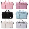 A set of five portable quilted travel duffle bags in pink, black, light blue, and cream colors.