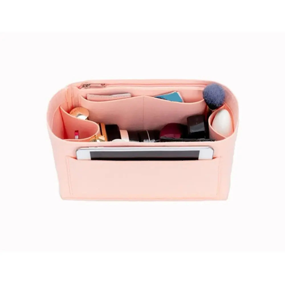 A pink felt insert liner for handbags showing various small accessories and compartments.