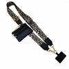 Black and gold leopard print phone lanyard with a detachable black leather wallet