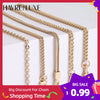 Multiple gold chain bag straps displayed against a white background for sale
