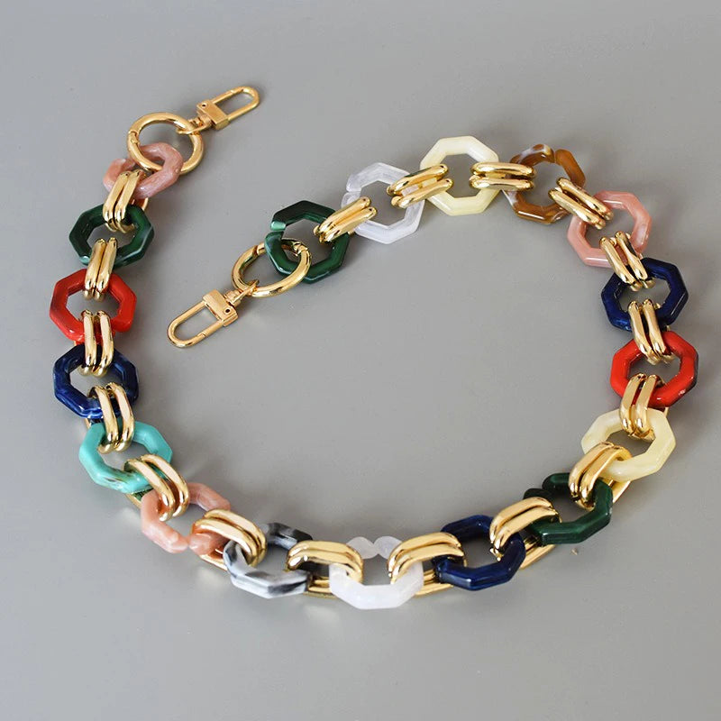 A multi-color acrylic chain strap featuring various shades of pink, green, blue, and yellow.