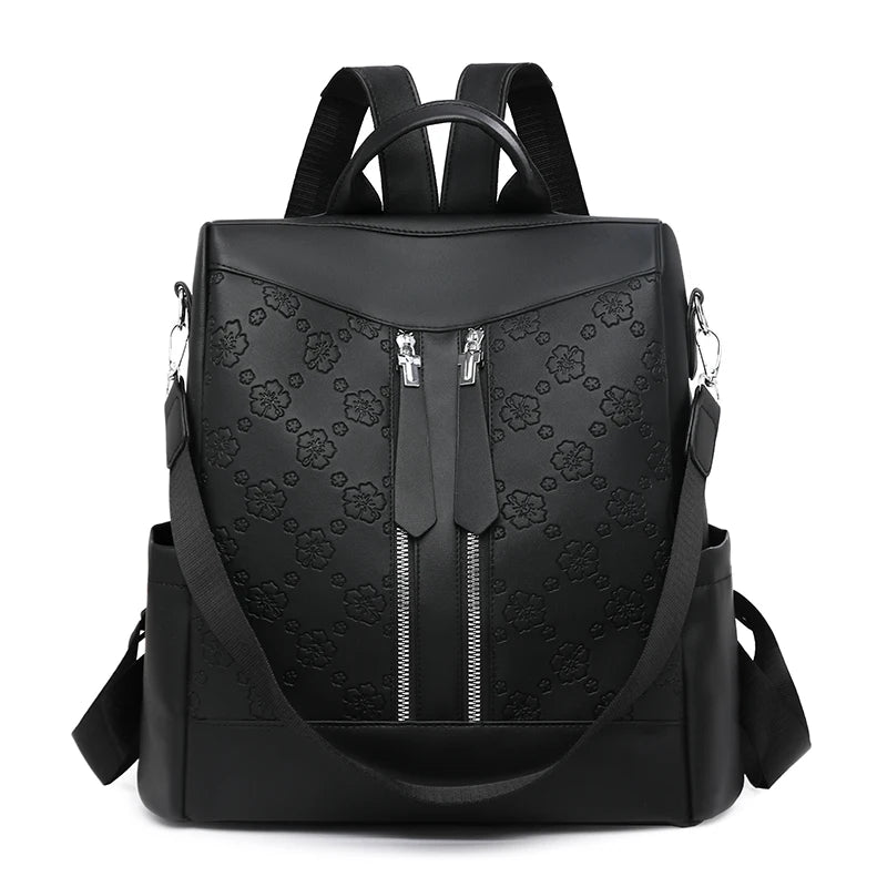 Black leather anti-theft women's backpack with padded straps and zippered compartments