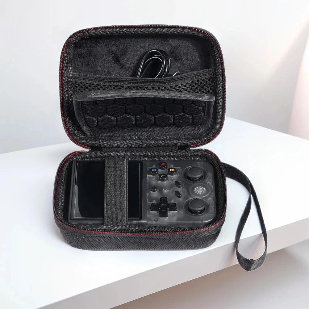 A black portable hard case for a handheld console is shown open, displaying the console and accessories.