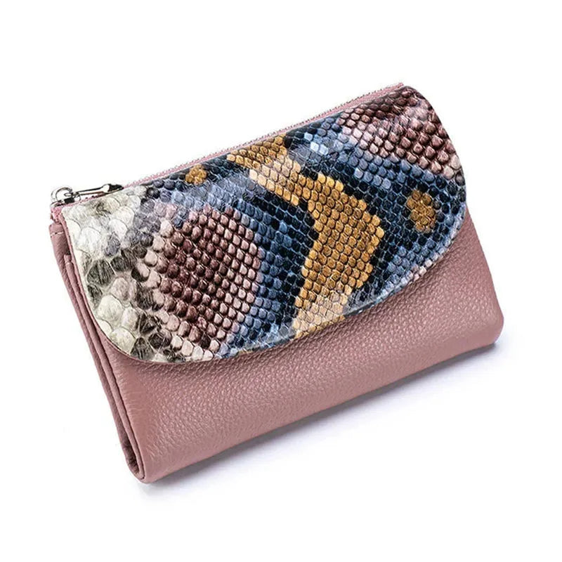 A pink genuine leather mini card holder wallet with a patterned flap featuring snakeskin textures.