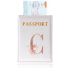 A pink leather passport holder featuring a gold initial C and floral embroidery.