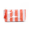 A cosmetic storage pouch with vertical orange and white stripes and a tassel detail.