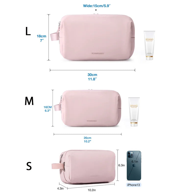A set of three cosmetic toiletry bags in pink for large, medium, and small sizes shown with iPhone 13.
