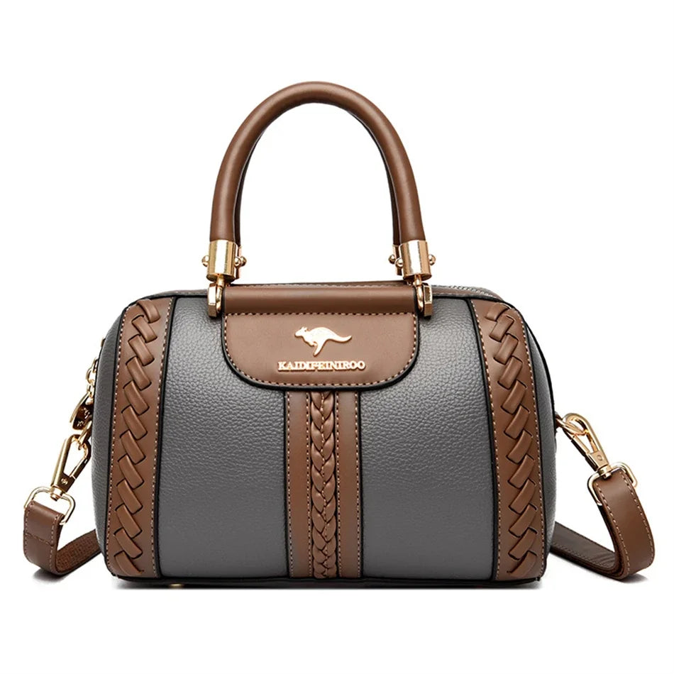 A brown leather shoulder crossbody bag with gold hardware and a woven texture in gray and brown stripes.