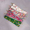 A collection of colorful floral pattern adjustable crossbody bag straps in various prints.