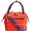 Orange insulated cooler lunch bag with a purple detachable crossbody strap