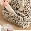 A leopard print insulated lunch bag is shown open with a light-colored tablet or notebook inside.