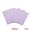 A stack of ten purple polishing cloths for silver and gold jewelry, measuring 6x8cm each.