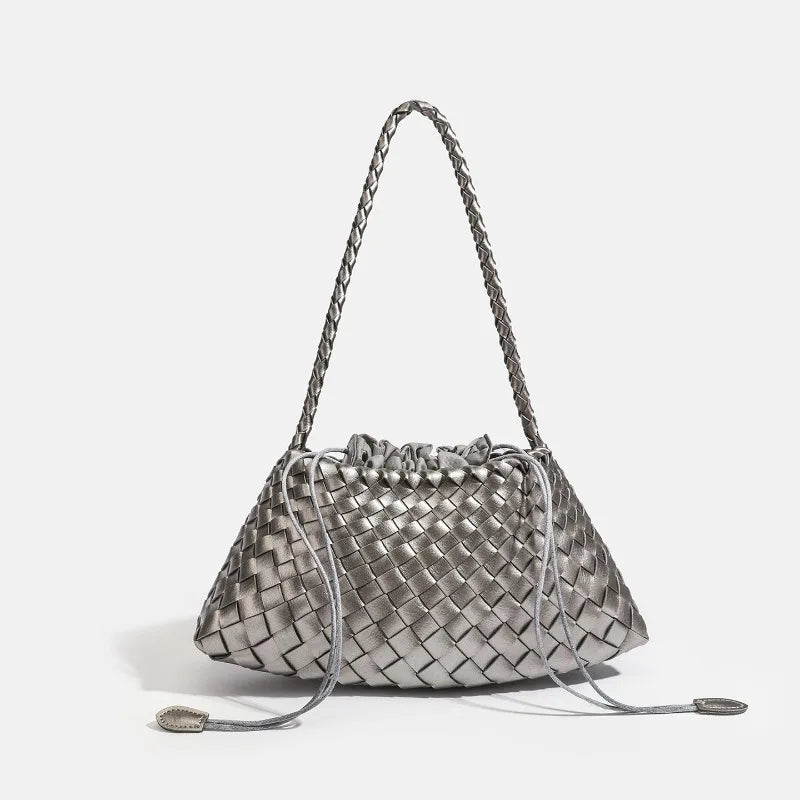 A silver metallic woven leather shoulder bag with a braided strap is displayed against a white background.