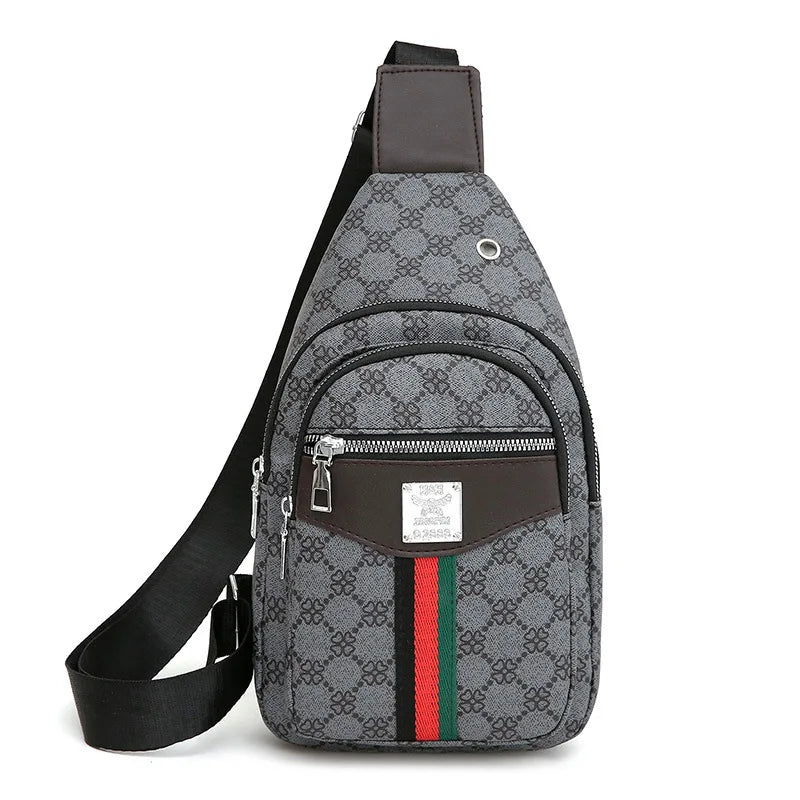 A gray and black patterned printed crossbody sling bag with brown accents and a black strap.