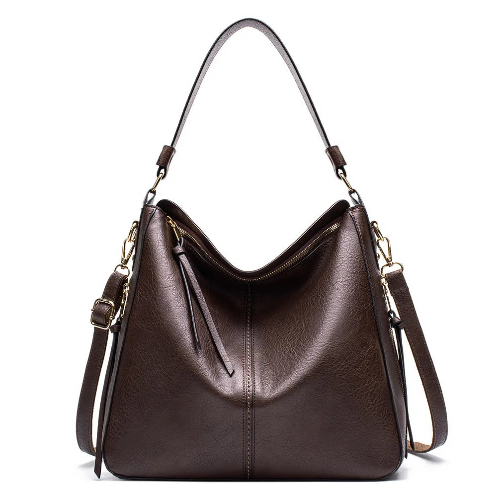 A dark brown vintage faux leather hobo shoulder bag with gold hardware shown from the front.