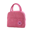 A pink insulated lunch bag with a handle and a circular logo featuring a panda face.