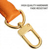 Gold hardware and orange leather strap component for a handbag