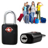 A black keyed luggage lock is shown next to several pieces of luggage and people.