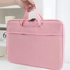 A pink premium laptop sleeve is being held by a hand, showing the padded design and zipper closure.