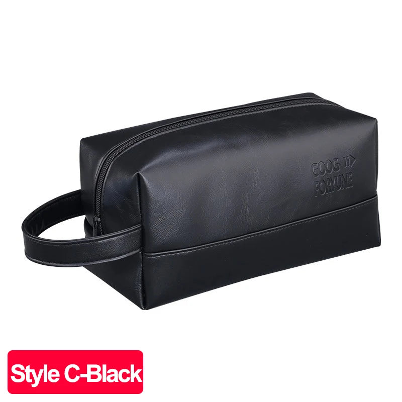 Black PU leather travel toiletry bag with a handle and a logo embossed on the side.