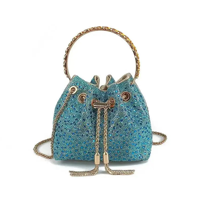 A sparkling blue crystal-embellished evening clutch with a gold chain strap.