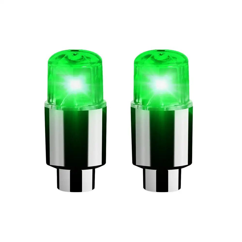 A pair of bright green LED tire valve stem lights for vehicles.