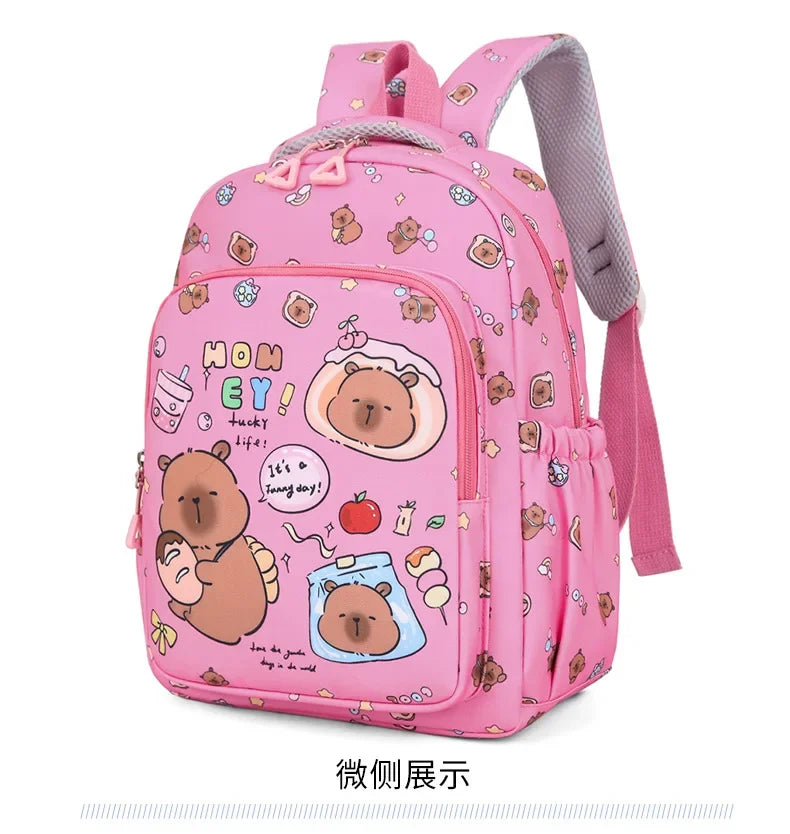 A pink cartoon animal backpack featuring cute bear characters and various accessories.