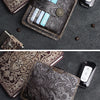 A dark brown genuine leather card wallet with a floral pattern is shown next to a smartphone.