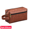 A brown PU leather travel toiletry bag with a zipper and leather strap.