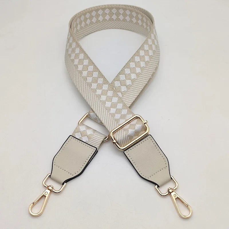 A beige braided nylon bag strap with metal hooks shown against a white background.