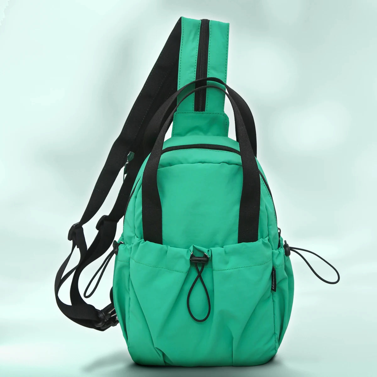 A bright green casual backpack with black straps and a laptop compartment shown from the front.