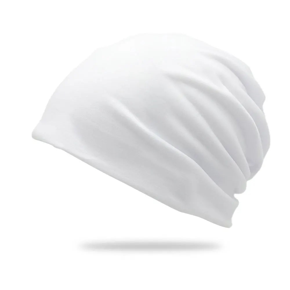 A white slouchy knit beanie hat shown from the side.