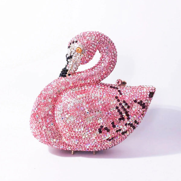 Pochette de soirée en cristal rose en forme d' cygne avec détails noirs et bec taillé en or.