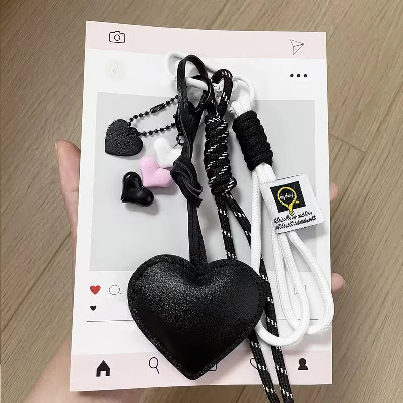 Black and white heart keychains made of PU leather with braided rope
