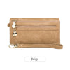 A tan leather wallet with a double zipper closure and a gold-toned charm.