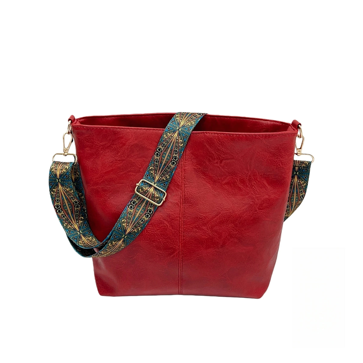 A deep red leather crossbody hobo bag with a patterned blue and gold strap.