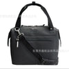 Black insulated cooler lunch bag with a detachable black crossbody strap