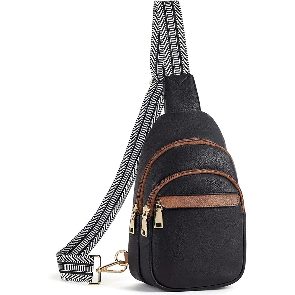 Black PU leather chest sling bag with a striped strap and brass hardware