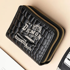 A black crocodile print fashion PU leather double zipper wallet with gold trim.