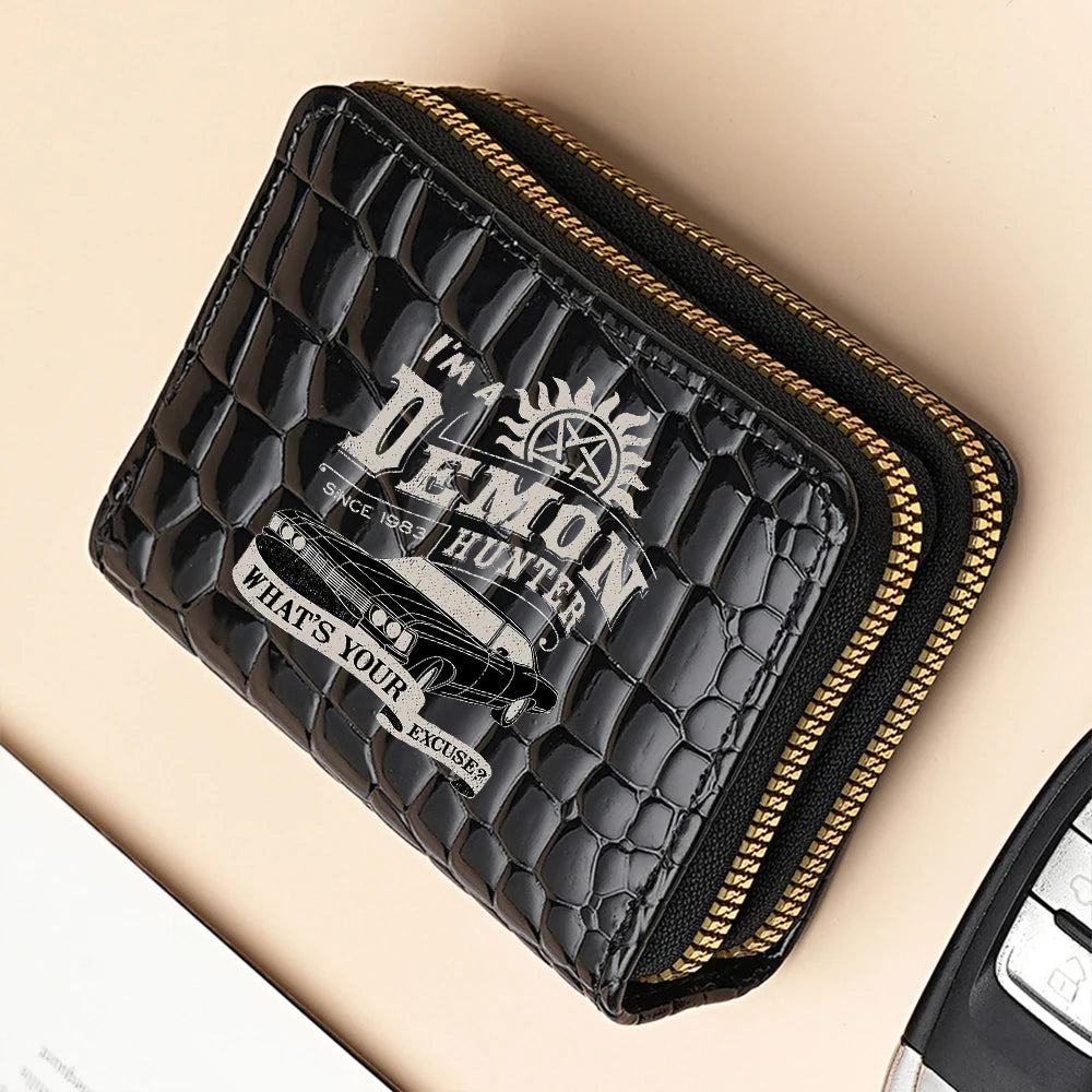 A black crocodile print fashion PU leather double zipper wallet with gold trim.