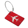 A red luggage tag with a white airplane silhouette attached to a silver cord.
