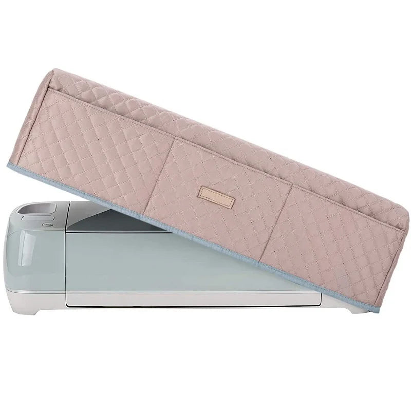 A light pink protective cover for a Cricut Maker machine.