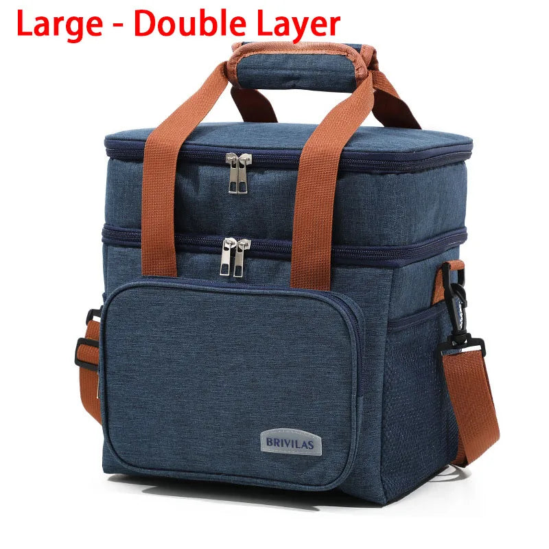 A dark blue insulated double-layer lunch bag with brown straps and zippered compartments.